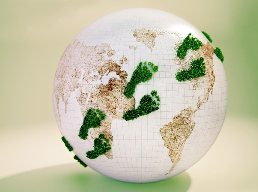Digitizing the working world - World globe with green footprint